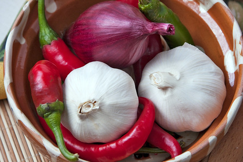 Two bulbs of garlic, a red onion and several chilli pepers