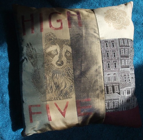 raccoon high five pillow