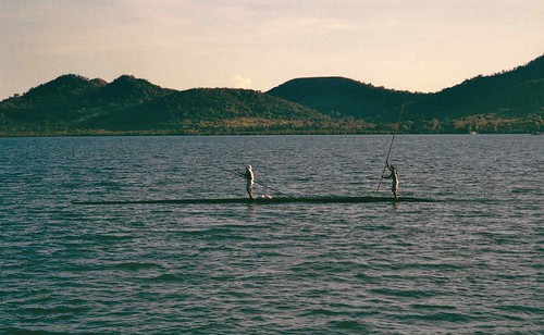 Canoe in bay; Coron Island behind, Busuanga, N. Palawan, Philippines by Lon&amp;Queta