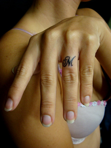 Girl finger with Tattoo Design Letters Girl finger with Tattoo Design 
