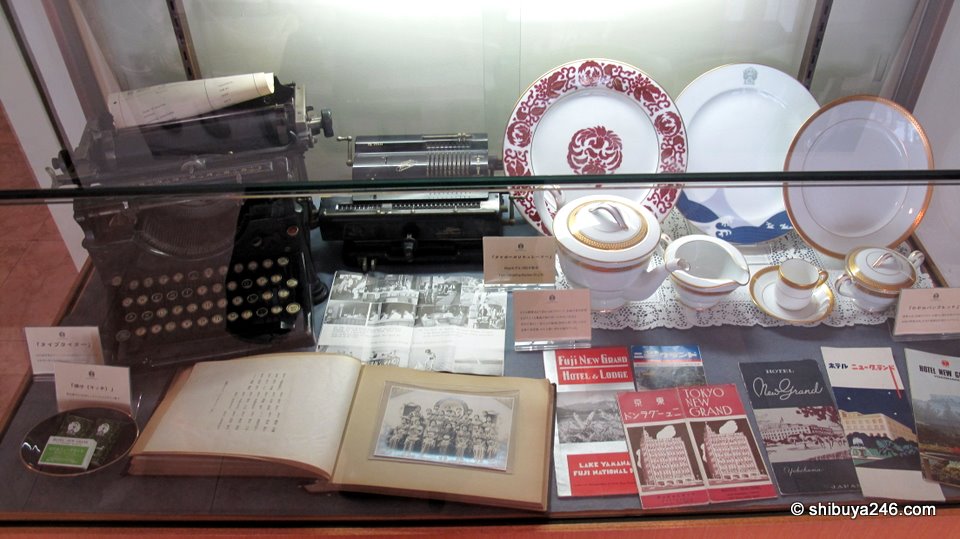 A display showing some of the old photos, china and typewriter that was previously used in the hotel.