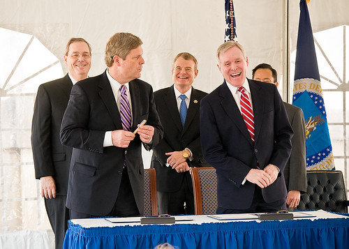 Secretary Vilsack presents a pen, made from a corn cob, to Secretary Mabus.  The pen is from Iowa, where Vilsack served as Governor prior to his appointment to USDA by President Obama. 