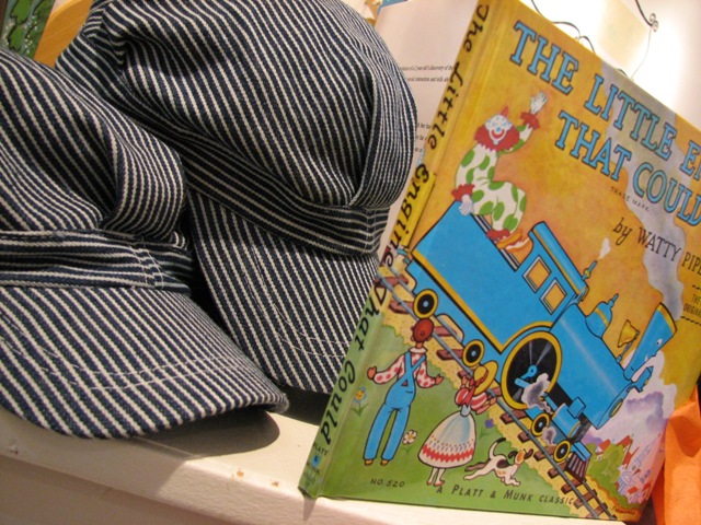 train book and hat