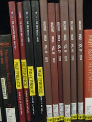 Reference books on a shelf.