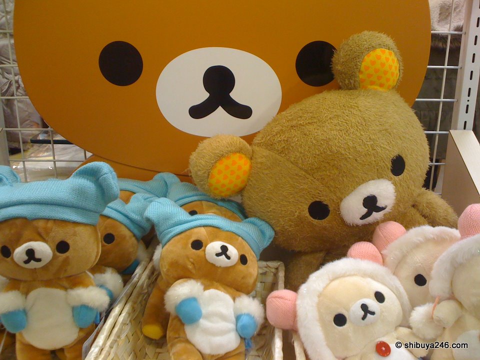 Looks like Rilakkuma might be getting ready to go out into the cold. He has gloves and hat on. Maybe this is a winter edition plush.