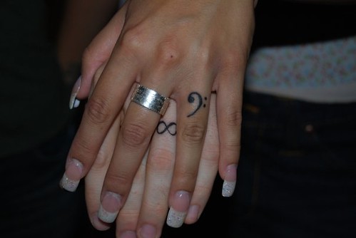Wedding Tattoos I dig how Jen and Grady's wedding ring tatts don't match