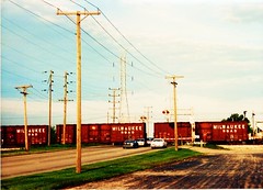 Former Milwaukee Road boxcars in transit on a northbound Indiana Harbor Belt Railroad train.  Bridgeview Illinois. September 1989.