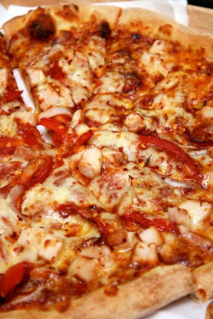 Chili chicken pizza - smoked chicken breast, onion, red pepper, red chili flakes