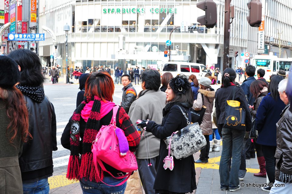 Shibuya street fashion on show as people wait to cross at the lights.