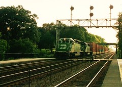 Eastbound Burlington Northern freight train approaching Highlands station. Hindsdale Illinois. September 1993.