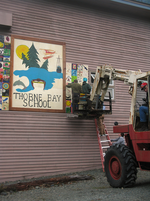 installing new signage at Thorne Bay School, Thorne Bay, Alaska
