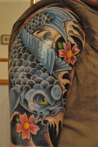 kissing fish tattoo. tribal fish tattoos.