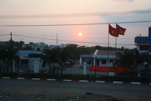 Vietnam flags and a sunset
