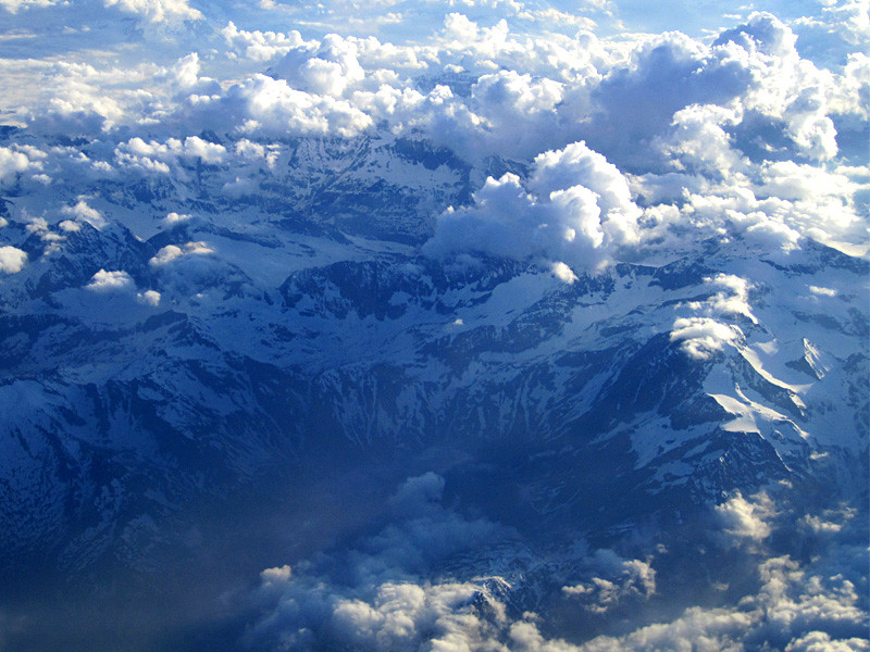 swiss alps and clouds