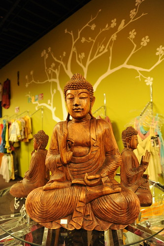 Buddha statue in wood, tree mural, store, Anchorage, Alaska, USA by Wonderlane