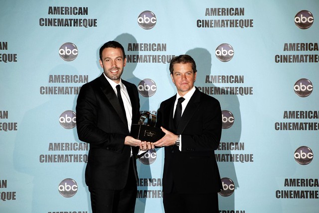 Matt Damon receiving award from Ben Afleck by rufloresphoto