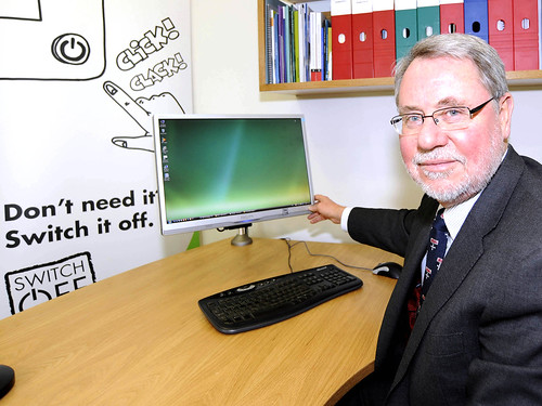 Professor Chris Brink switching off his monitor