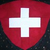 Swiss Shield (pieced by Elizabeth from TQC) pattern by hardhatcat