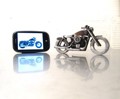 Palm Pre and a scrap metal motorcycle sculpture Sportster Forty Eight