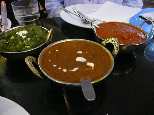 Selection of curries: saag paneer, dhal mahkani and goat vindaloo
