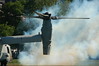 Marine Week Boston, 2010: Bell-Boeing MV-22B Osprey tilt-rotor aircraft kicking up a cloud of smoke from the engines before taking off from Boston Common