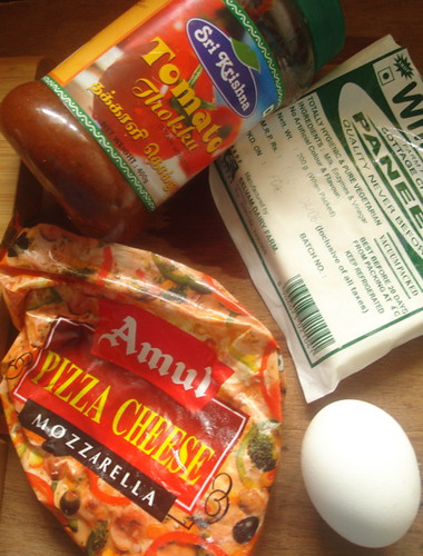 Tomato Sauce, Mozarella cheese, egg for egg wash and some Paneer