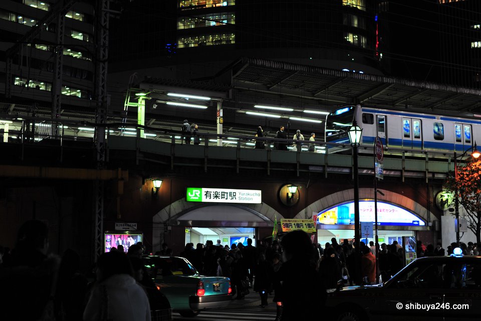 Yurakucho Station with people bustling about on Xmas Eve.
