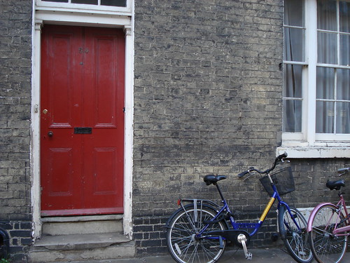 Red door with bike(s)