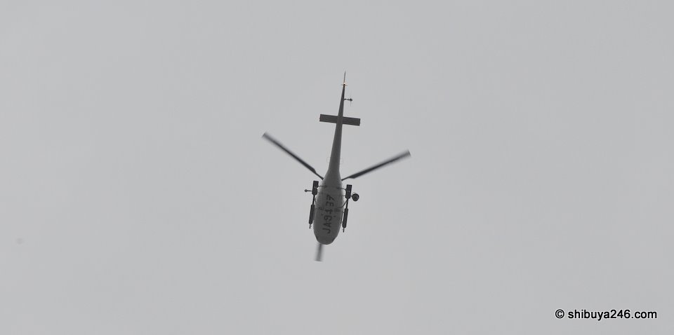 There was a helicopter hovering overhead for a good 30 minutes. Normally one helicopter is joined by others as the news crews circle to take photos for a story. Today there was just this one helicopter.