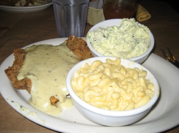 Chicken fried steak with mac n cheese and potato salad