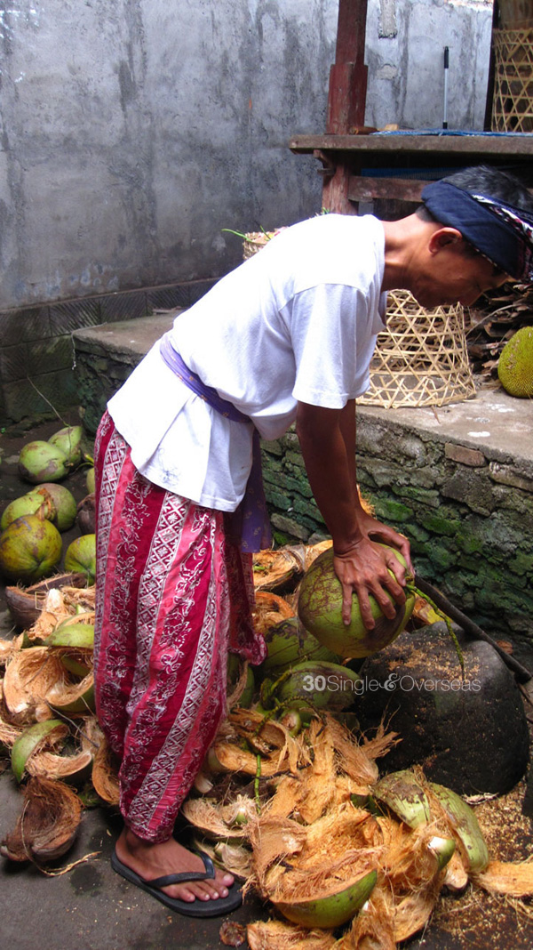 Chief of town preparing coconut water for us