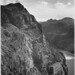 Photograph from Side of Cliff with Boulder Dam Transmission Lines Above and Colorado River to the Left