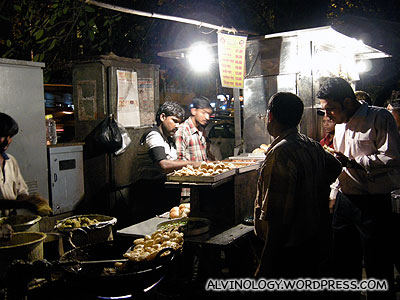 Street vendor; we usually try street food in other countries, but refrained here