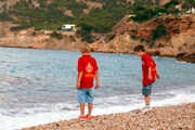 Before: Two Spanish boys frolicking on a beach in Altea
