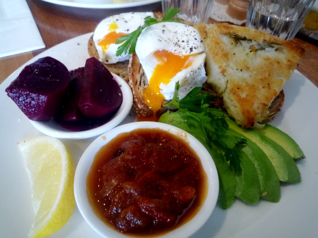 Poached eggs with potato and rosemary rosti, avocado, relish and pickled beetroot