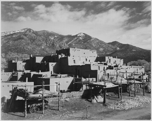 Full view of city, mountains in background, "Taos Pueblo National Historic Landmark, New Mexico, 1941."