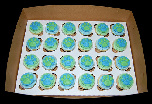 Blue and green puppy paw print birthday cupcakes