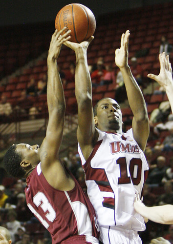 February 14, 2010 - Javorn Farrell goes for the basket as Hawk's Darrin Govens tries to steal the ball. 