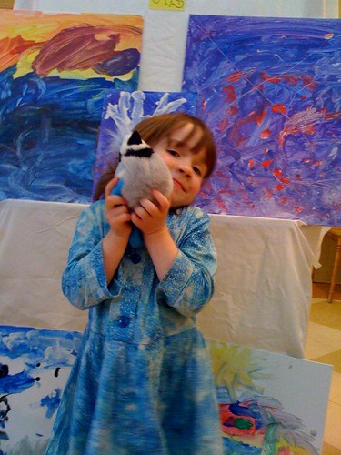 The artist with her paintings