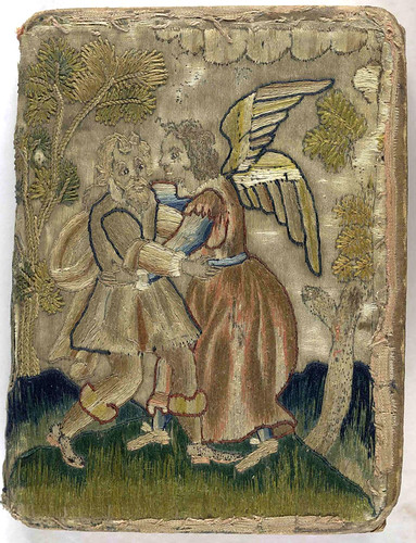 17th century embroidered satin book with pictorial angel and trees.