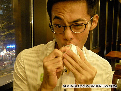 Happy Hock Chuan sucking on his ice cream