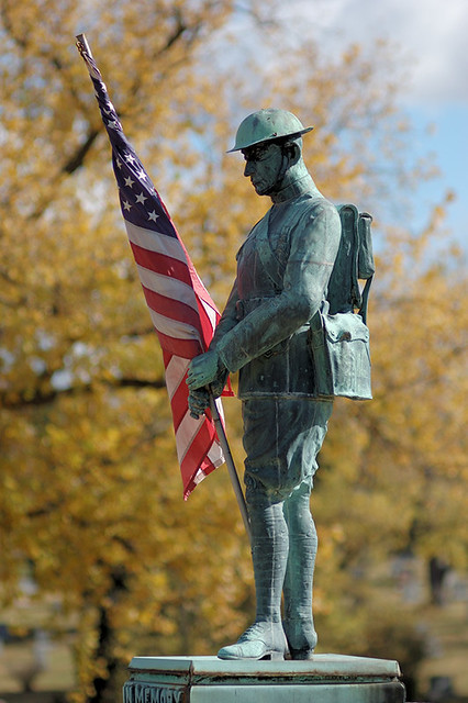 Sunset Memorial Park Cemetery, in Affton, Missouri, USA - statue of a Doughboy with American flag