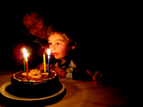 blowing out the candles on Papa's cake