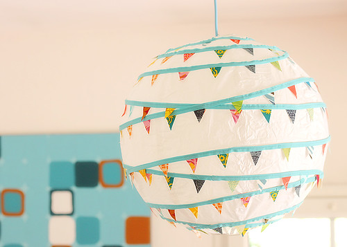 Here it is complete and hanging: a paper lantern with mini bunting. 
