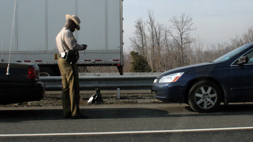 police trooper writing a ticket