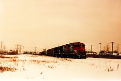 Eastbound Grand Trunk Western freight train departing from the Belt Railway of Chicago Clearing Yard. Chicago Illinois. January 1987.