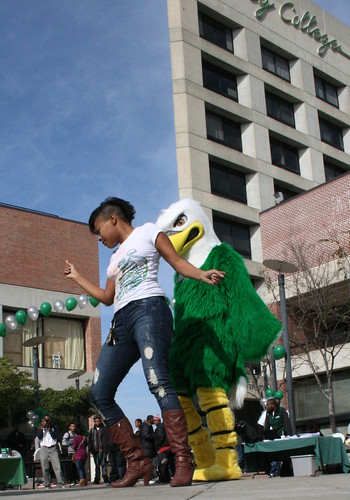 Eddie the Eagle and Laney College student Ebony Miller shake a tail feather at the Welcome Back Bash January 28, 2010