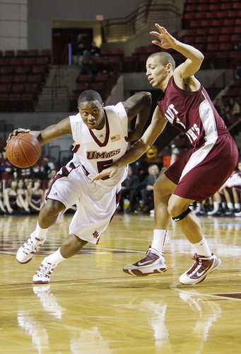 February 14, 2010 - Ricky Harris of the UMass Minutemen scored the most points against the Hawks in the UMass home game tonight in Amherst. Hawk's Garrett Williamson is attempting to block him. 