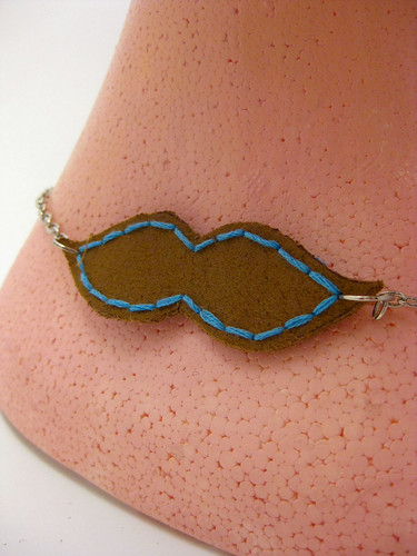 Embroidered moustache necklace