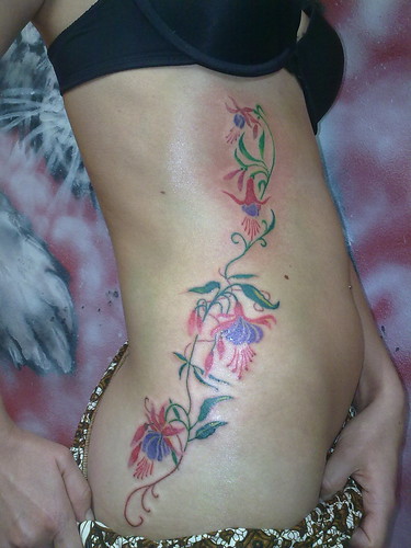 Flower Tattoo at Bursts Sides Woman Flower Tattoo at Bursts Sides Woman